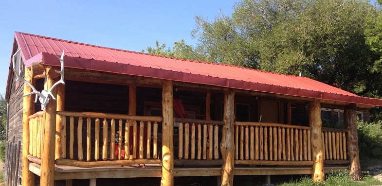 Bunkhouse with log deck built by Jason Reesor at Historic Reesor Ranch.