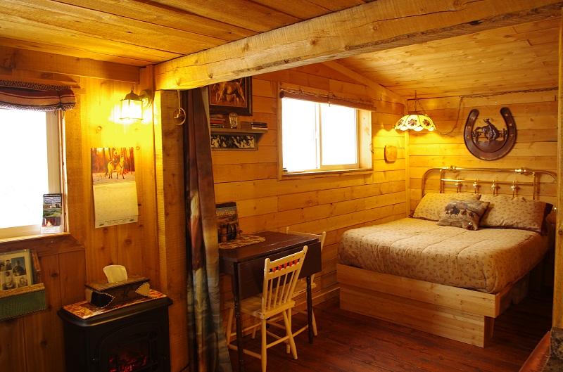 Comfy double bed in Cowboy's Cabin at Historic Reesor Ranch.