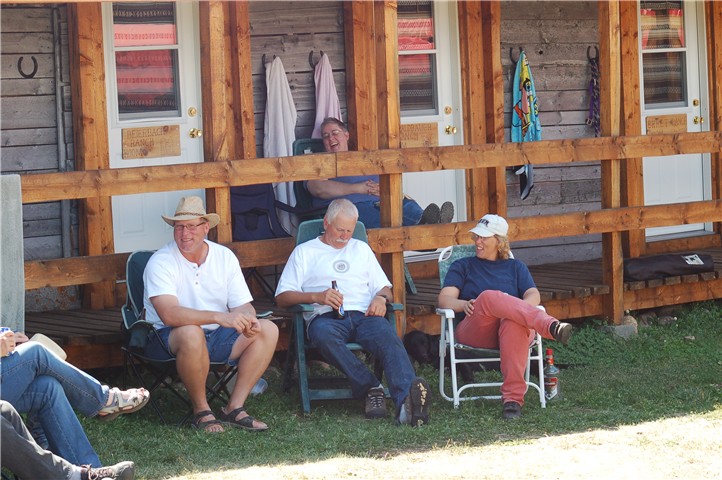 Family & friends relaxing in front of Ranchers' Row at Historic Reesor Ranch