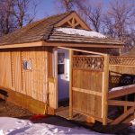 Frontier Cabin front deck with BBQ and chairs.