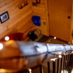 Hand hewn railing with twinkle lights!